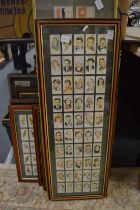 A collection of cigarette cards, framed and glazed.