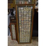 A collection of cigarette cards, framed and glazed.