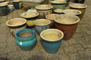 A quantity of glazed plant pots.