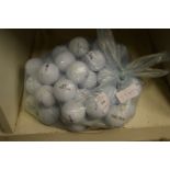 A bag of fifty Top Flite golf balls.