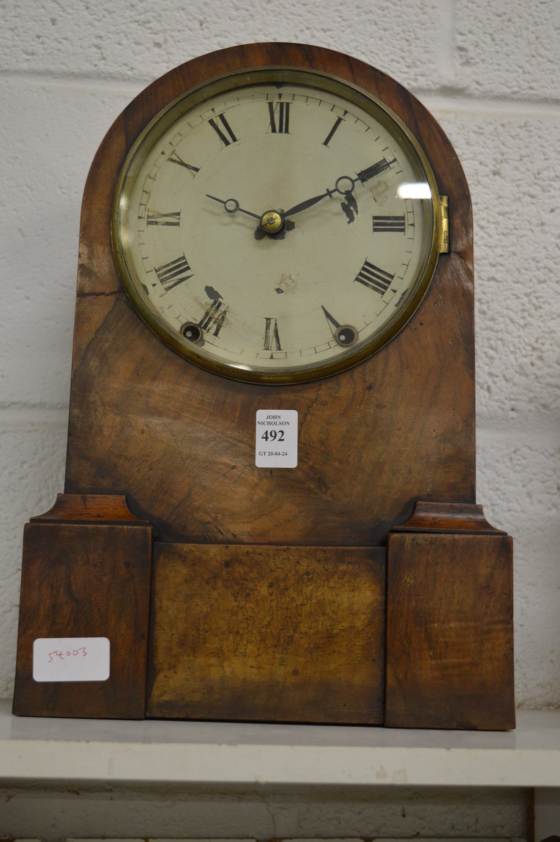 A walnut cased mantle clock.