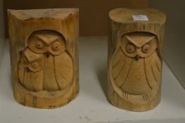 Two carved wood models of owls.
