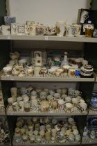 A large quantity of Royal Commemorative and Coronation china to include cups, mugs, teapots,