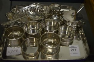 Silver napkin rings and other items.