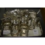 Silver napkin rings and other items.