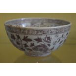 A Chinese circular bowl with floral decoration.