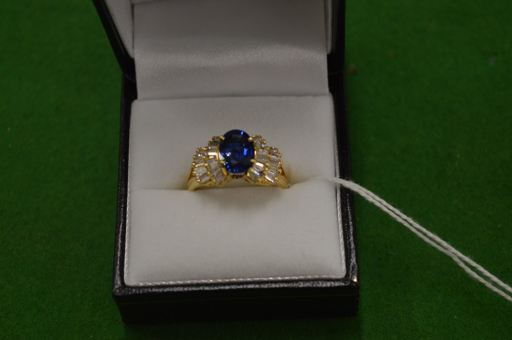 An 18ct yellow gold, diamond and sapphire ring, size N.