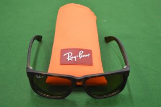 A cased set of designer sunglasses.