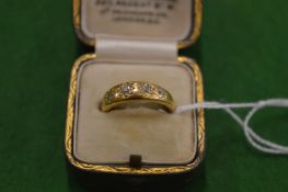 A gold and diamond five stone ring, size L (gold unmarked and untested).
