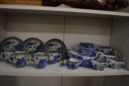 A collection of blue and white china to include twin handled cups and saucers (faults).