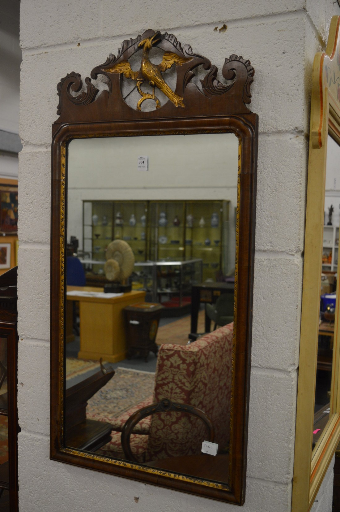 Georgian style walnut framed mirror with ho-ho bird cresting.