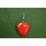 An unusual decorative pendant with gold mount modelled as a strawberry.