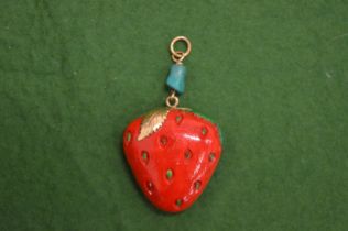 An unusual decorative pendant with gold mount modelled as a strawberry.