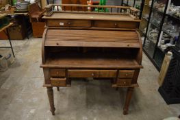 A reproduction roll-top desk.