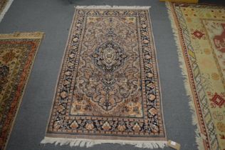 A small Persian style rug, grey ground with floral decoration 160cm x 90cm.