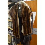 A ladies fur coat and two fur capes/stoles.