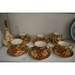 A small Worcester blush ivory bottle vase and various Crown Derby cups and saucers.