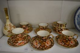 A small Worcester blush ivory bottle vase and various Crown Derby cups and saucers.