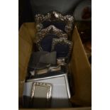 Various silver and other photograph frames.