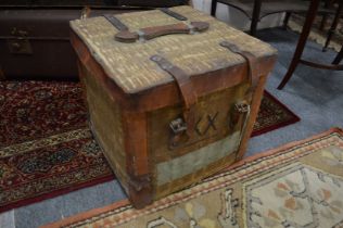 A leather and canvas covered wicker storage box.