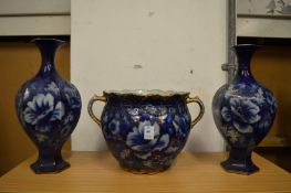 A twin handled jardiniere and pair of matching vases.