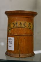 A two section turned wood spice jar, mace and cinnamon.