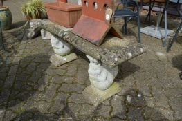 A reconstituted stone garden bench with squirrel supports (repaired).