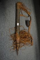 A good African quiver containing a quantity of barbed arrows together with a bow.