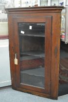 A 19th century oak hanging corner cabinet.