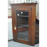 A 19th century oak hanging corner cabinet.