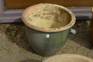 A large glazed planter.