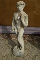 A reconstituted stone garden ornament as a standing male figure.
