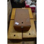 A large quantity of postcards in five wooden storage boxes with indexes.