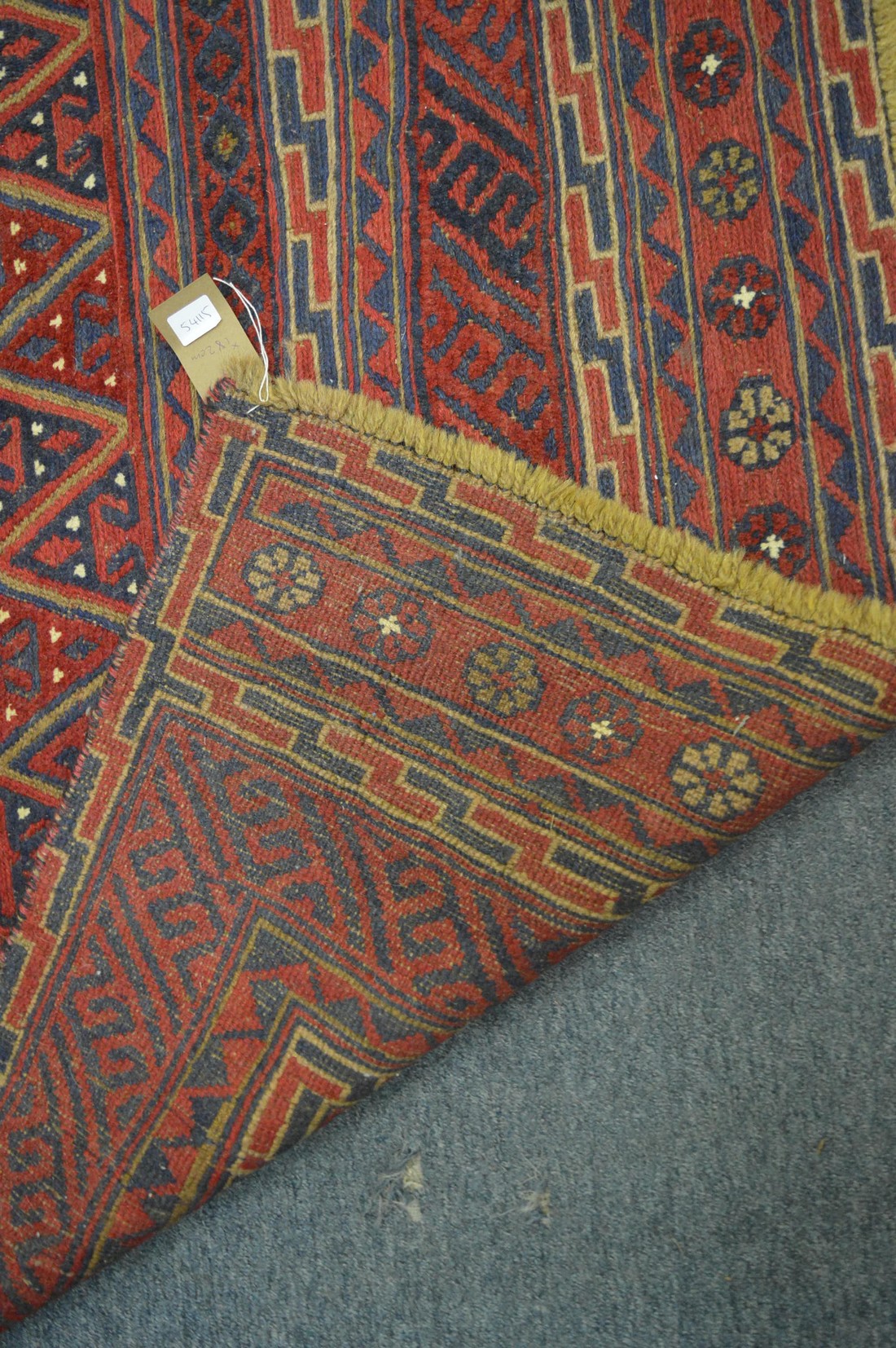 An unusual Persian style carpet, red ground with geometric decoration 182cm x 153cm. - Image 3 of 3