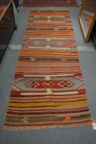 A Kilim runner 297cm x 95cm.