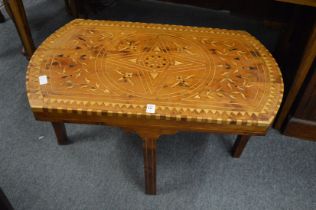 An Eastern inlaid olive wood occasional table.