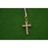 An 18ct white gold and diamond crucifix.
