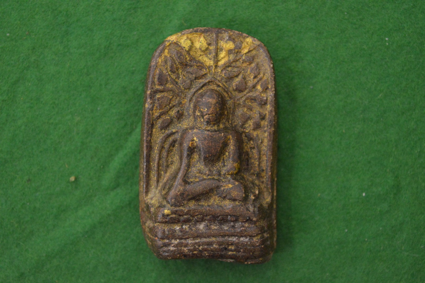 A small hard stone Buddha.