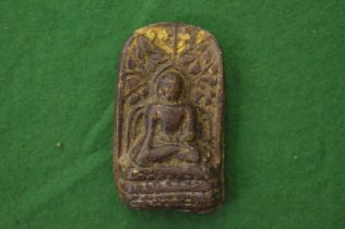 A small hard stone Buddha.