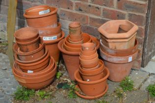 A quantity of terracotta plant pots.