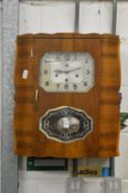 A Smiths walnut cased wall clock.