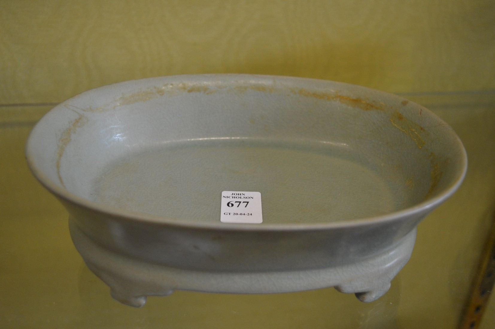 A Chinese celadon glazed shallow brush washer or jardiniere.