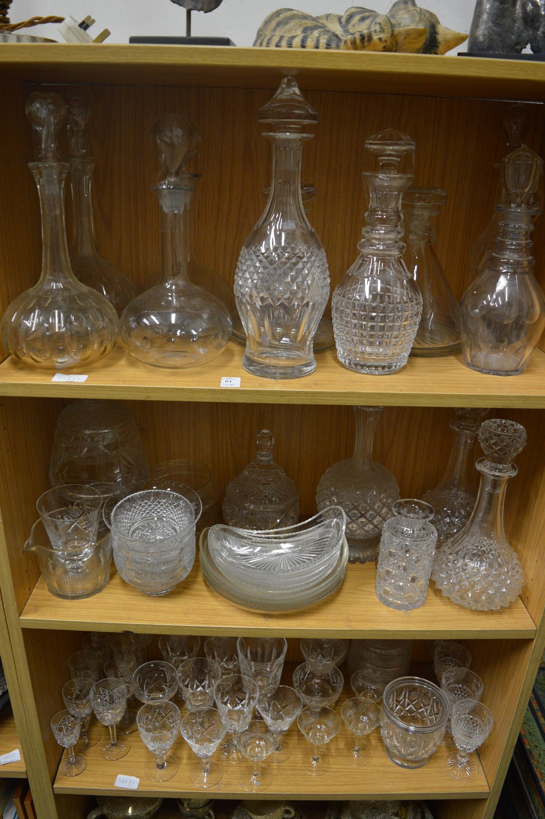 A quantity of cut glassware to include pairs and single decanters.