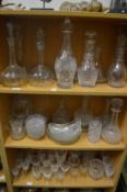 A quantity of cut glassware to include pairs and single decanters.