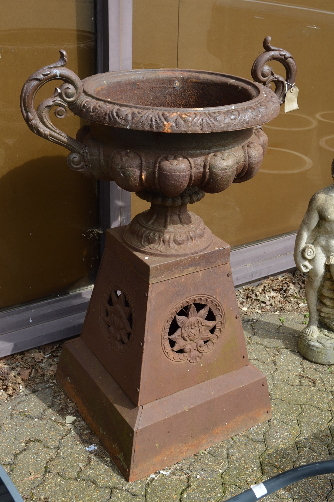 A good large pair of Victorian style cast iron twin handle urns on tapering bases. - Image 2 of 2