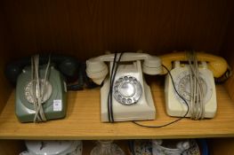 Three old telephones.