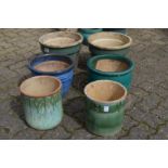 Six glazed plant pots.