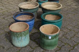 Six glazed plant pots.