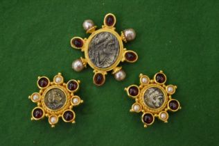 Linda Levinson, a decorative coin inset brooch and pair of matching ear clips.