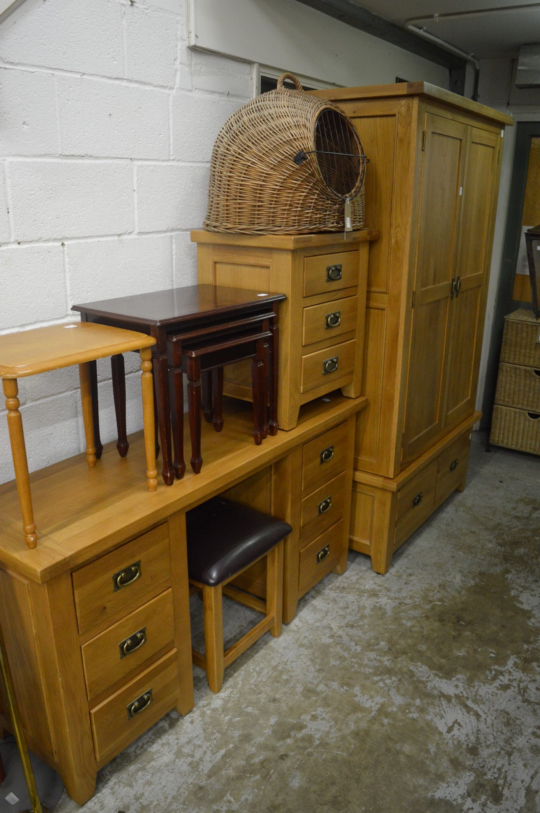 Modern light oak wardrobe together with a matching dressing table, stool and three drawer chest.